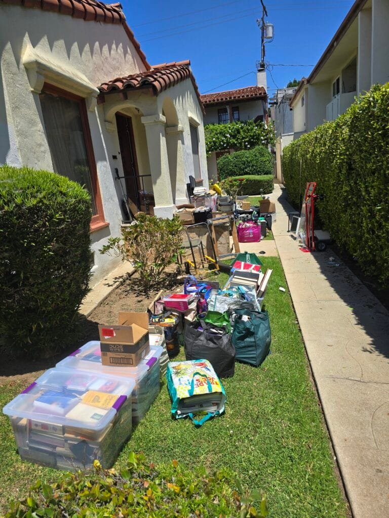 Junk Removal Tips for Los Angeles Homeowners and Businesses 3 Household items lined up along a walkway beside a house before pickup