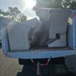 Same-Day Furniture Pickup Near Me: How Rapid Junk Pros Gets It Out Today 4 Same-day furniture pickup near me - Rapid Junk Pros truck loaded with couch furniture