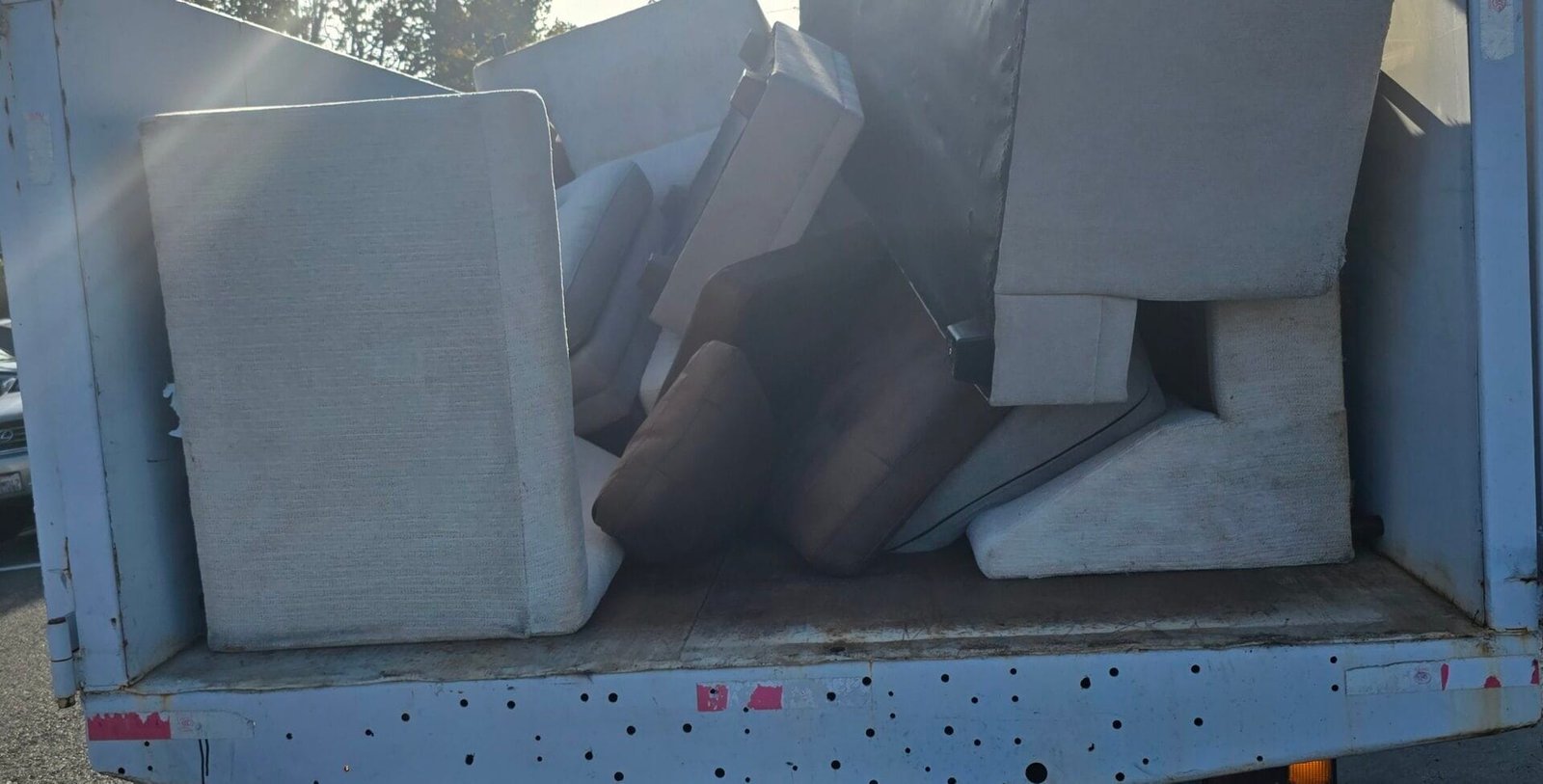 Same-Day Furniture Pickup Near Me: How Rapid Junk Pros Gets It Out Today 1 Same-day furniture pickup near me - Rapid Junk Pros truck loaded with couch furniture
