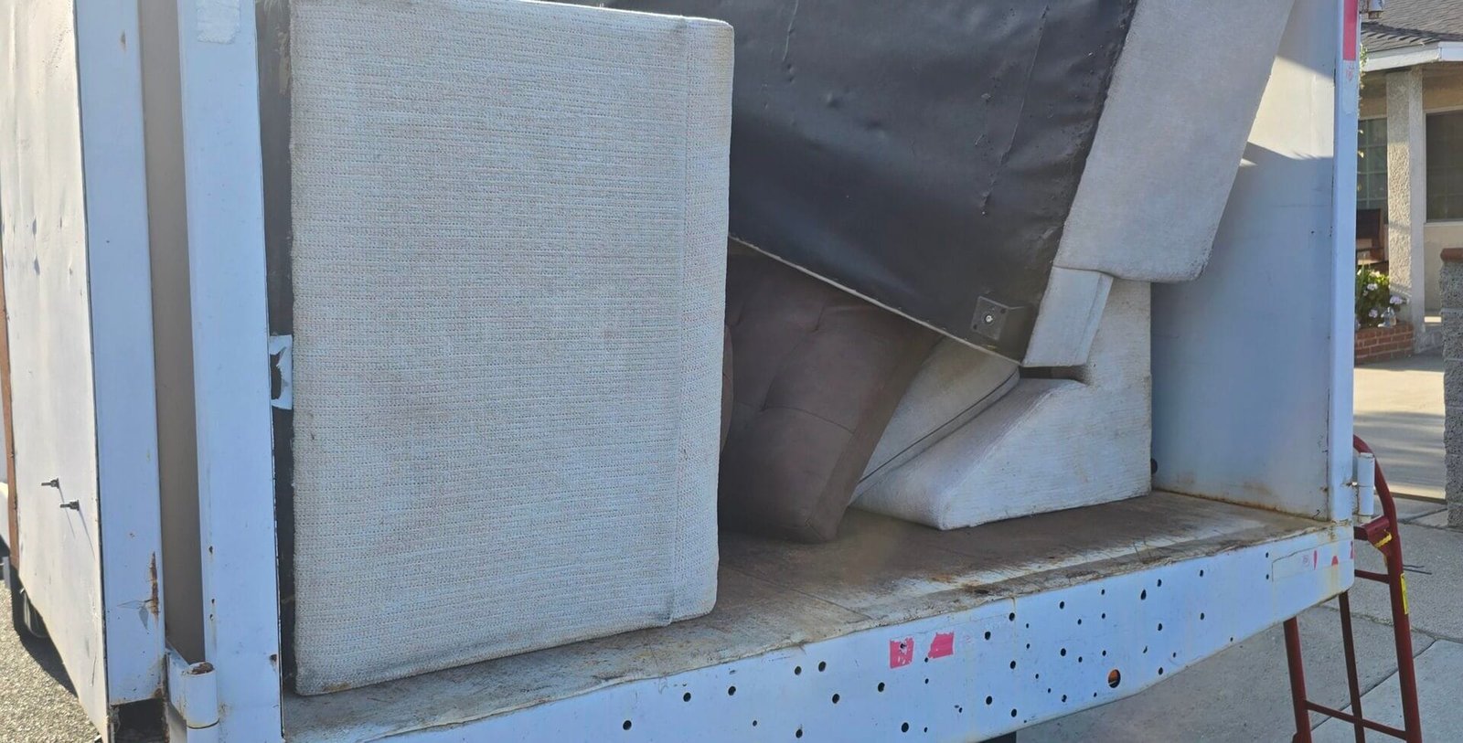 Piano Removal Los Angeles: The Real Guide to Getting an Old Piano Out of Your House 1 Piano removal Los Angeles - Rapid Junk Pros crew hauling an upright piano