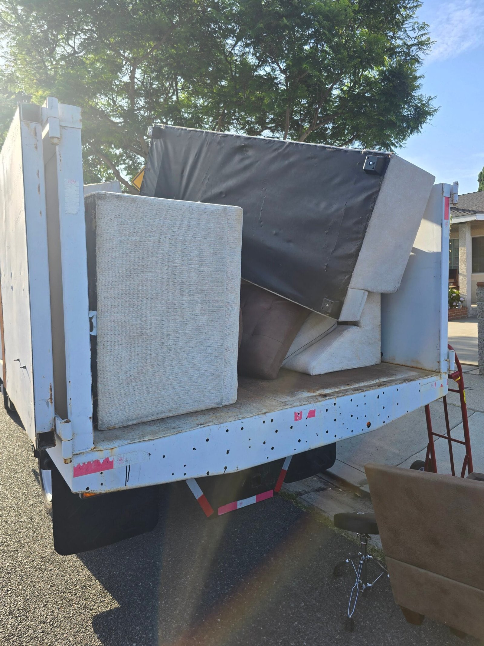 Piano Removal Los Angeles: The Real Guide to Getting an Old Piano Out of Your House 2 piano removal Los Angeles crew safely hauling an upright piano