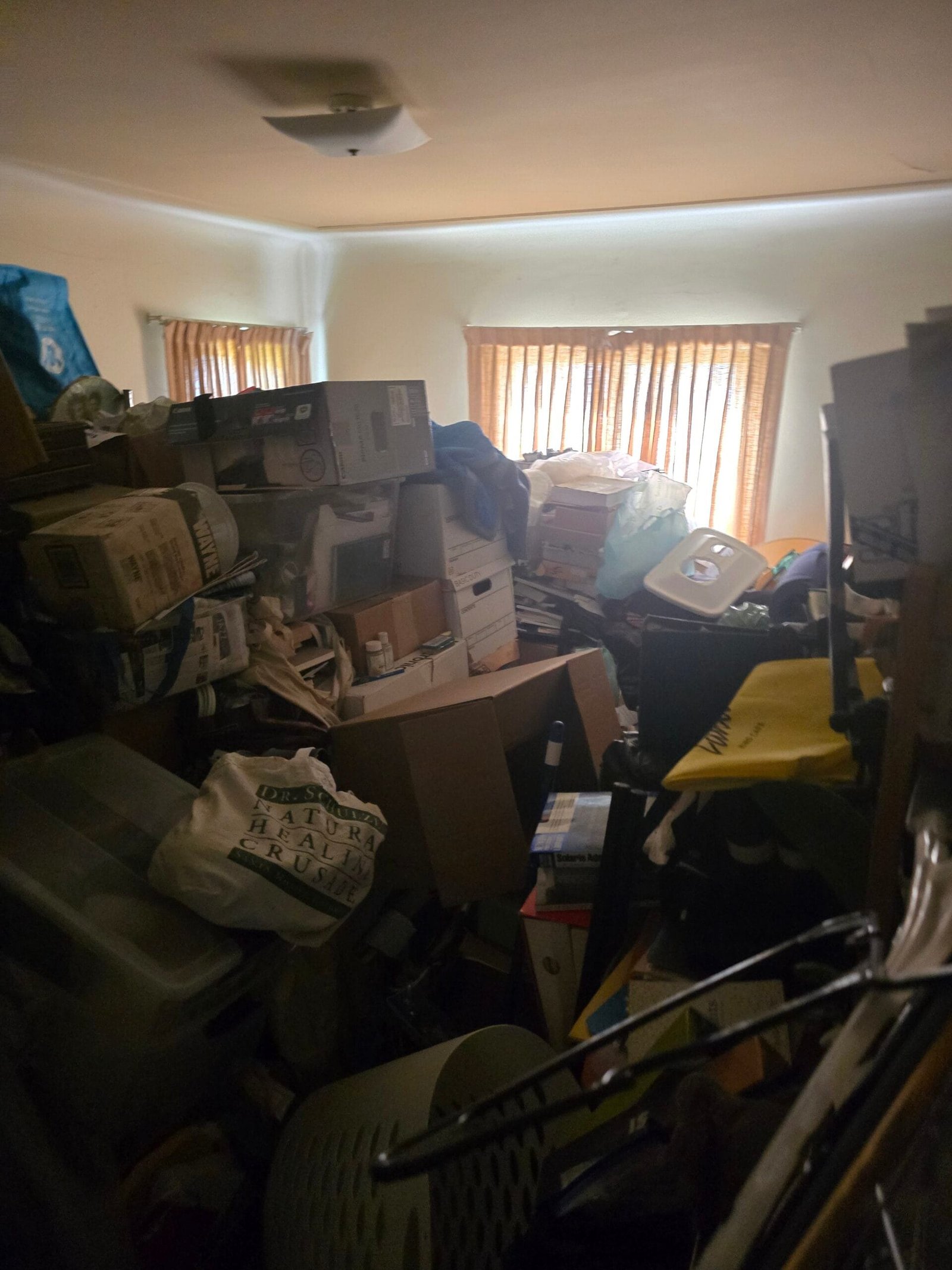 Junk Removal in El Sereno, CA 2 Junk removal in El Sereno crew hauling furniture out of a home